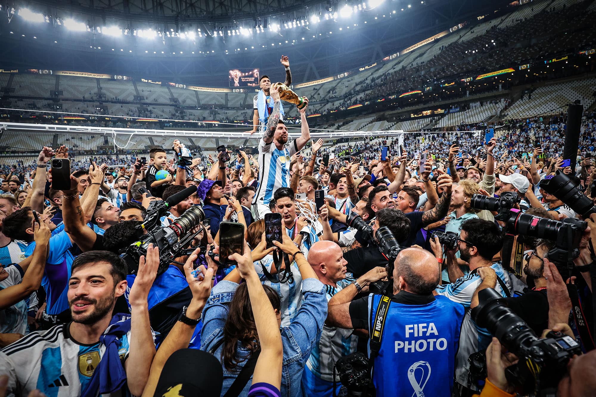 Lionel Messi celebrates with the World Cup trophy after the final, Lusail Stadium, Qatar 2022 - photographed by Marc Atkins
